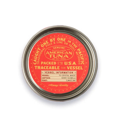 Tuna can lid with red label and metal rim on a white background