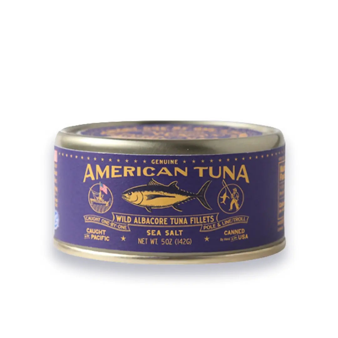 Can of American Tuna with purple label on a white background