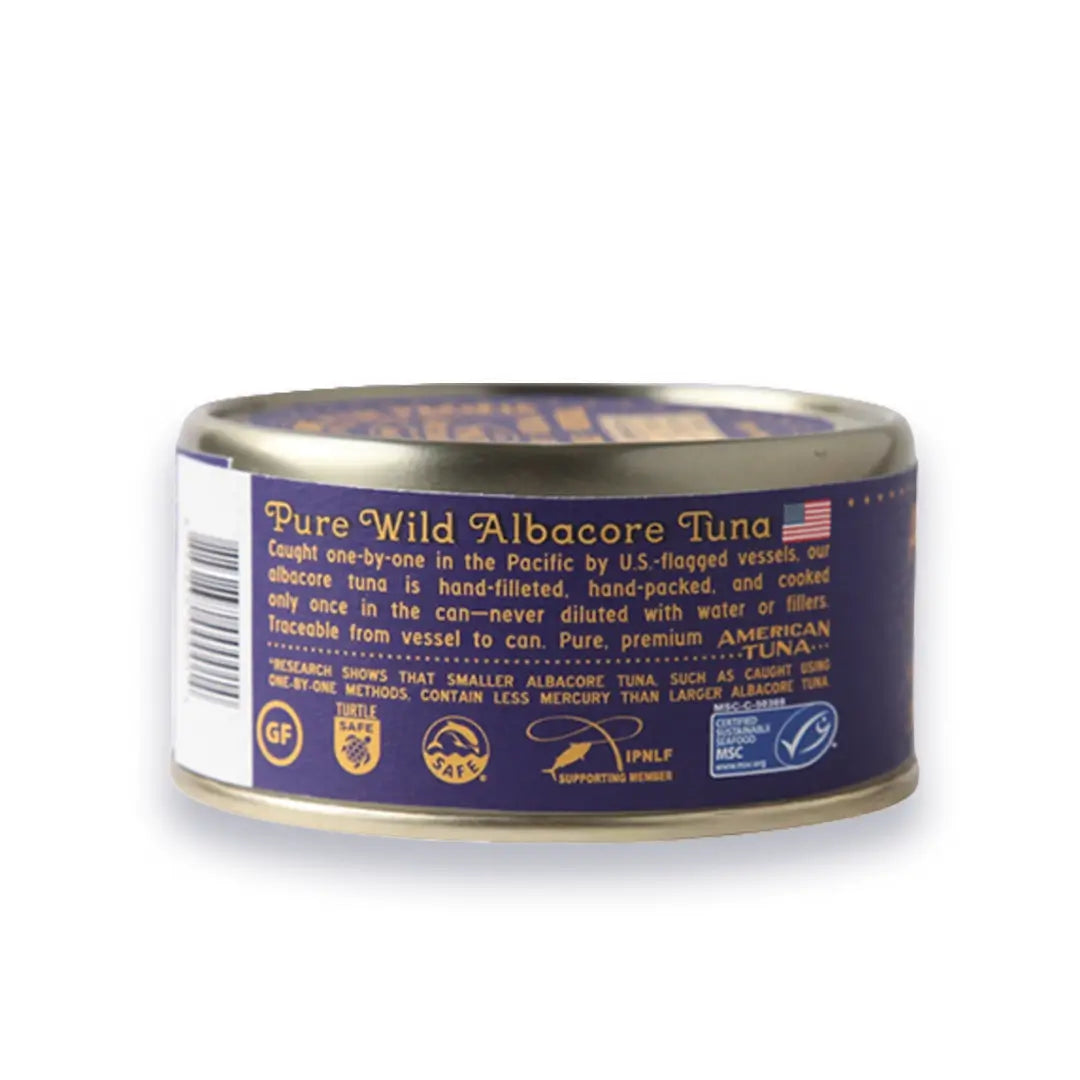 Can of pure wild albacore tuna with a purple label on a white background
