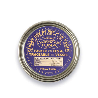 Metal can with purple label on a white background